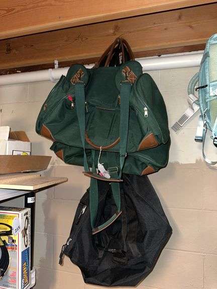 Five duffle bags, backpack, red suitcase image