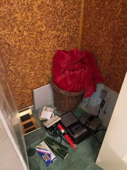 Blanket, picture frame, basket, cassette recorder, sketchbook, miscellaneous image