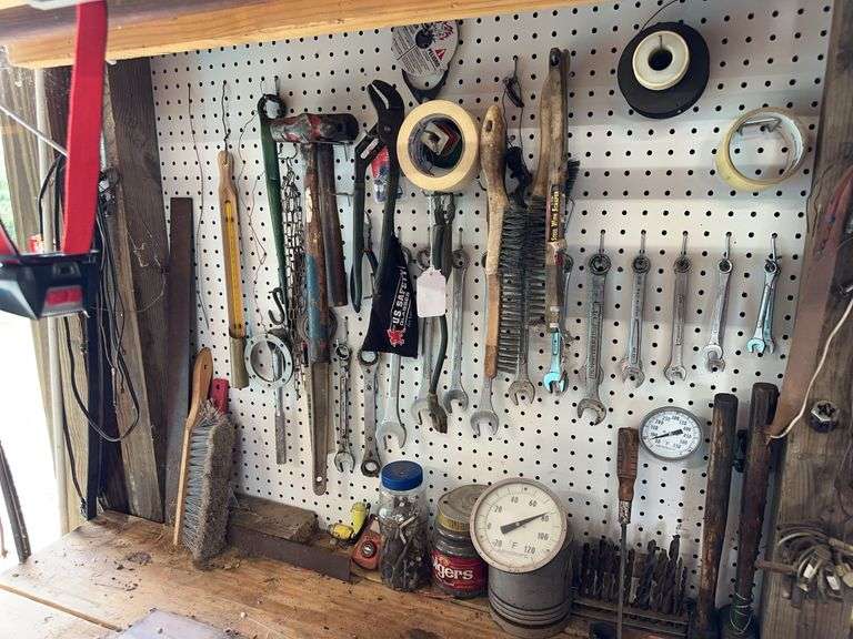 Wrenchs, hammers and misc on back wall image
