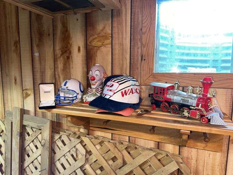 Clown liquor decanter, plastic toy train, 2 hats, mini Colts helmet, Mickey Mouse watch, tie tac image