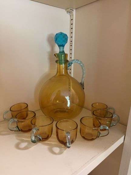 Vintage amber blown glass jug with blue faceted stopper & rope twist applied handle with 7 matching cordials image