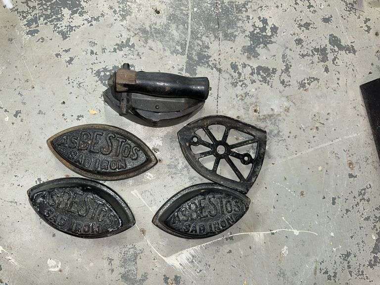 Sad irons, trivet, handle image