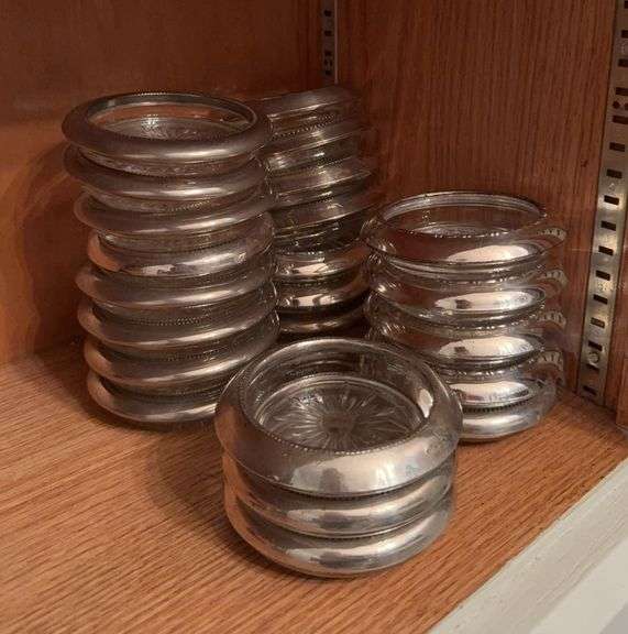 23 glass coasters with silver plate trim image