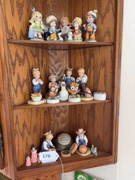 3 shelves of children figurines image