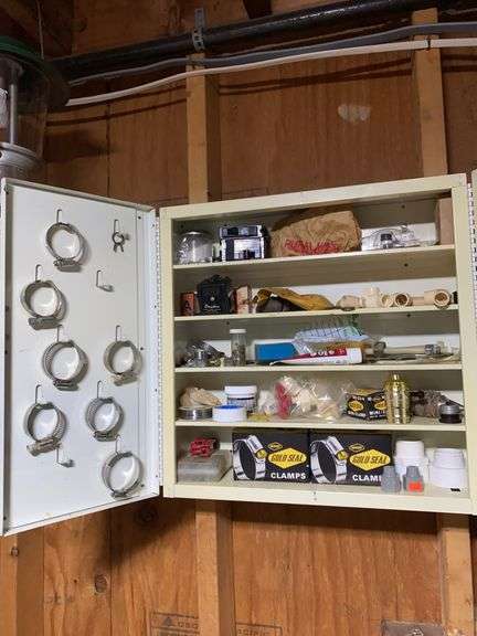 Contents of metal wall box (box stays with house), clamps, lamp parts, switches, plumbing, misc image