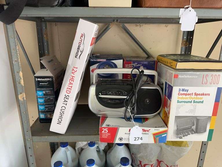 Speakers, radio, coin jar, glass barometer, heated seat pad, Sirius radio, file folders image