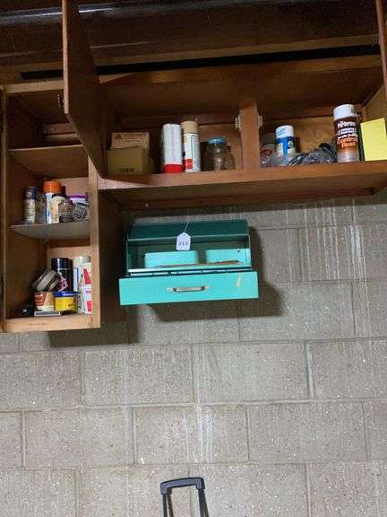 Contents only of wood and metal cabinets, (cabinets stay with house) image