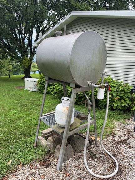 Small fuel tank on stand- empty, lp tank, misc metal image