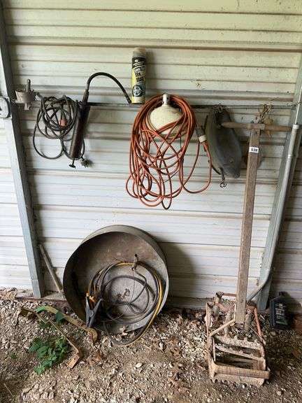 Vintage garden tiller, misc on wall image