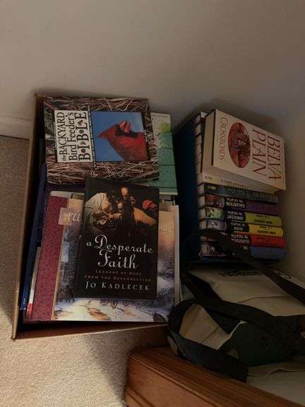 Contents of closet: books, heaters, games image