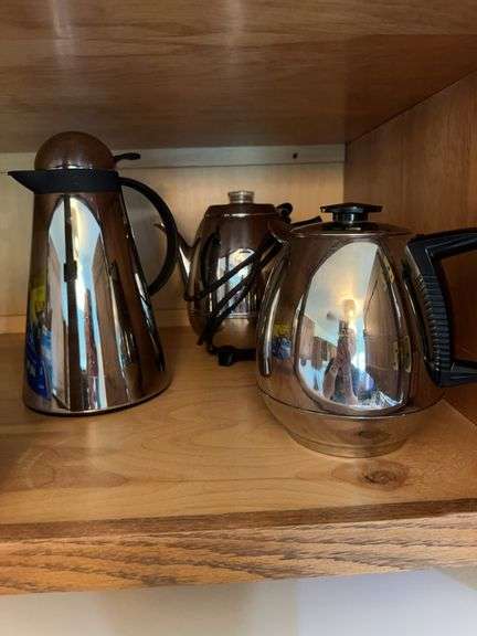 Contents of cabinet above refrigerator image