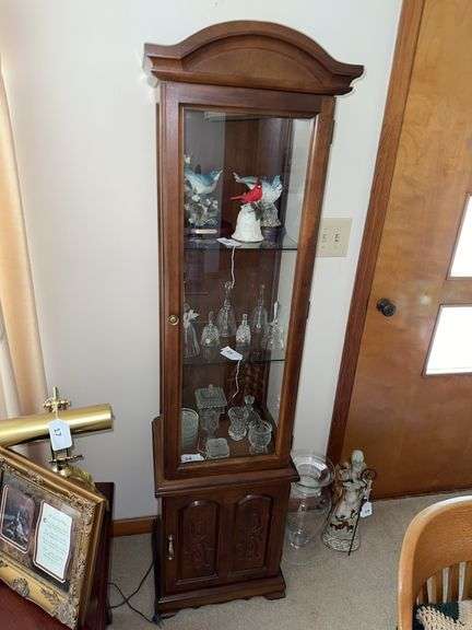 Glass front lighted curio cabinet image