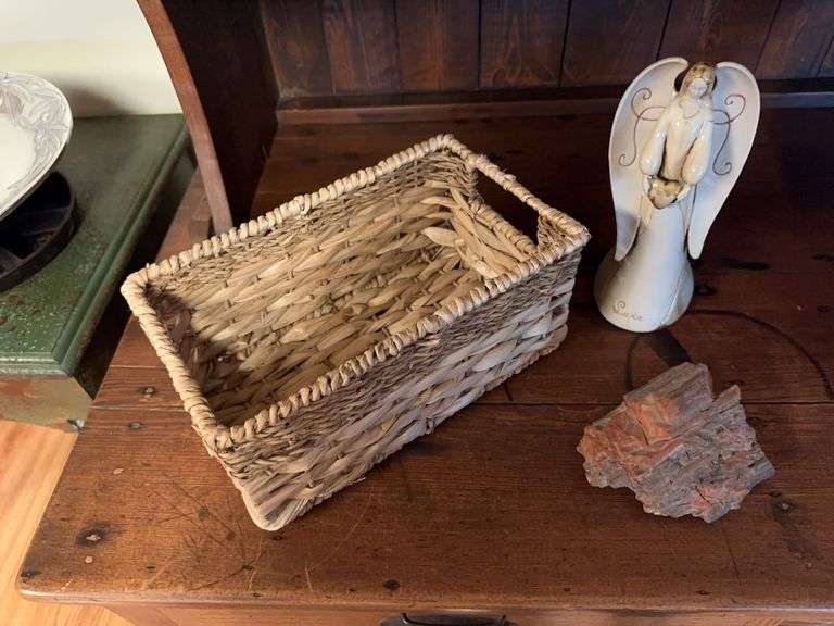 Angel figure, woven basket, stone piece image