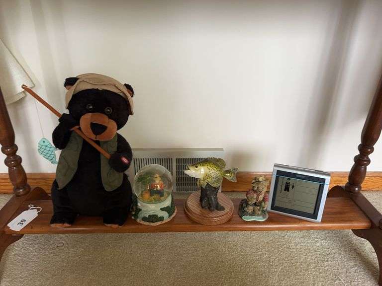 Plush fishing bear, snow globe, mounted fish, bear fisherman figure, LaCrosse wireless forecast station image