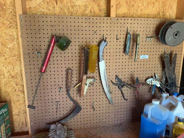 Tools on pegboard, work gloves image