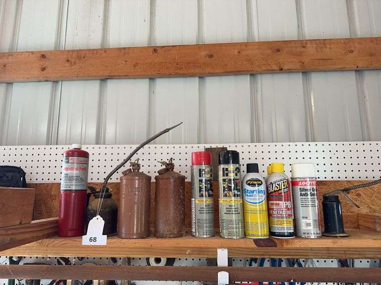 Empty tool bag, oil cans, misc image
