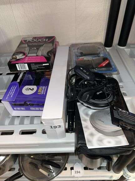 Curling iron, purse pouch, CD case, radio cassette player, CD player image