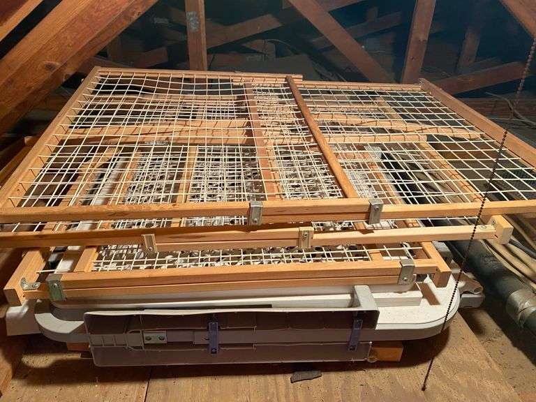 Items in attic, pet gates, live animal trap, projector, milk crate, vintage baby seats image