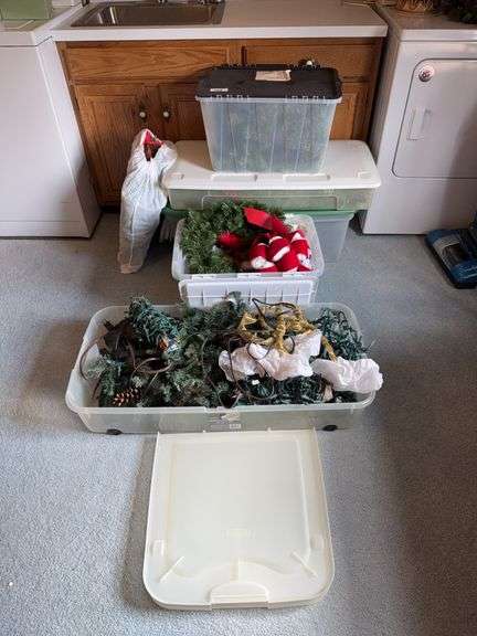 Five tubs of Christmas greenery, wreaths, bows image