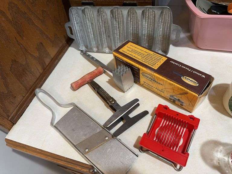 Nut cracker, corn stick pan, vintage chopper, strainer, knives, misc image