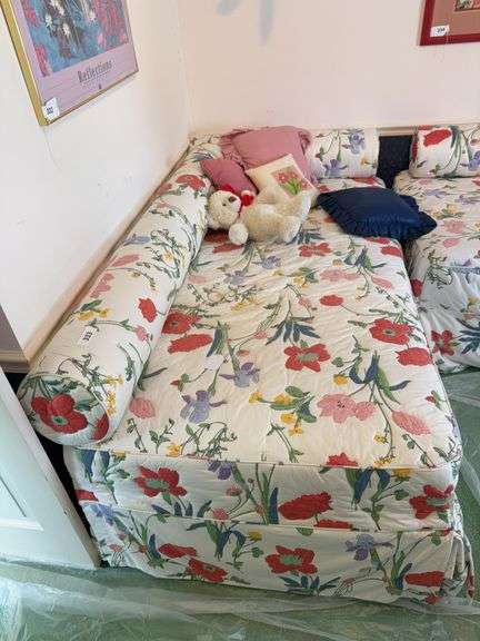 Two twin beds, stuffed animals, pillows image