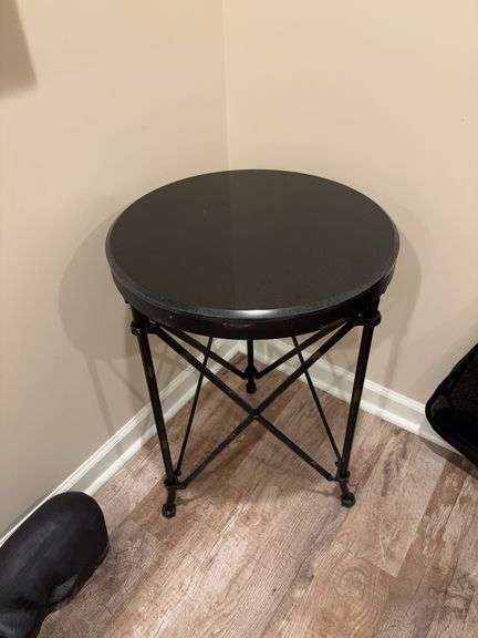 Round rod iron table with granite top 20” diameter and 28” tall image