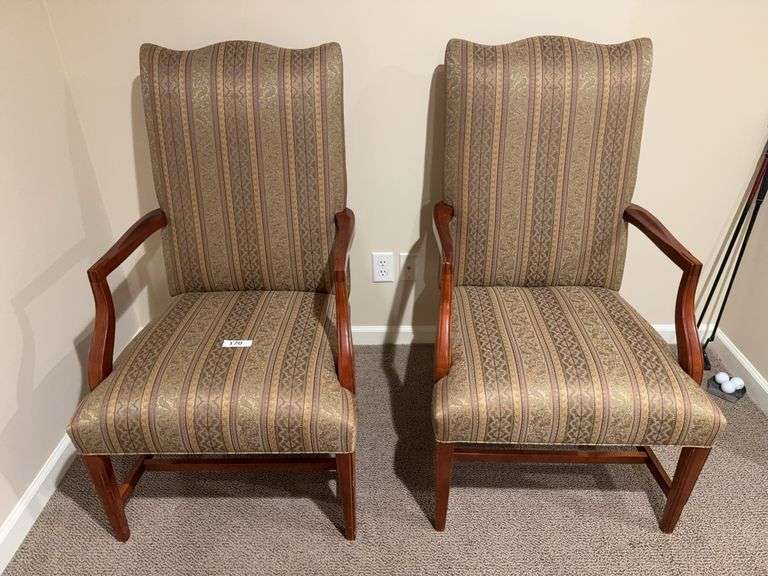 2 wood frame, upholstered arm chairs, throw image