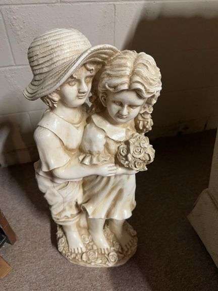 Large ceramic statue of boy and girl 27” tall image