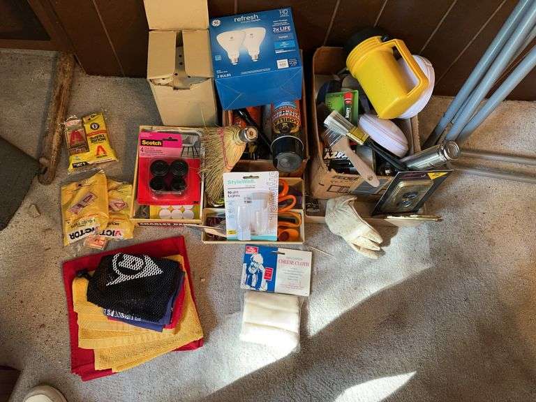 Folding chair, flashlights, screwdrivers, scissors, mousetraps, several cans Gorilla waterproof patch, night lights, misc image