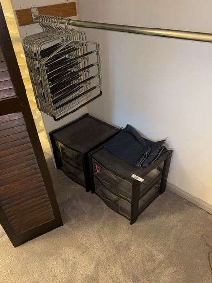 Plastic storage bins, clothes hangers image