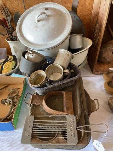 Vintage enameled and granite dishes, measuring cups, strainer, tomato slicer, miscellaneous image