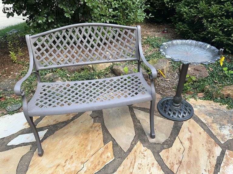 Metal bench and bird bath image