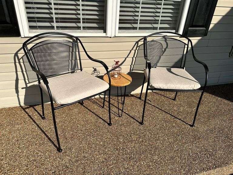 Pair of metal patio chairs with cushions, small table and decorative lantern image