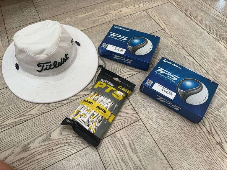 Titleist Aussie hat, 2 boxes of Taylor Made TP 5 gold balls, bag of Pride Sports gold tees image