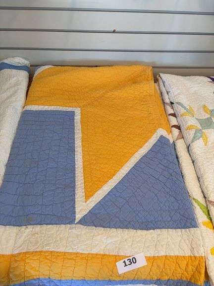 Blue, yellow, white vintage quilt image