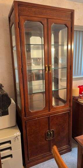 2 Thomasville lighted curio cabinets with connecting, lighted header