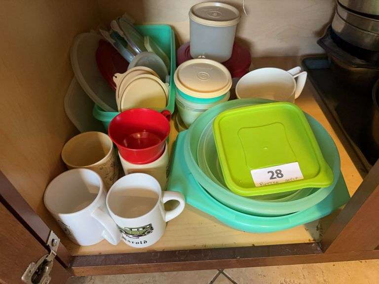 Contents of bottom shelf of cabinet