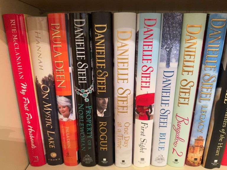 Two shelves of books: Steele, Higgins-Clark, misc. image