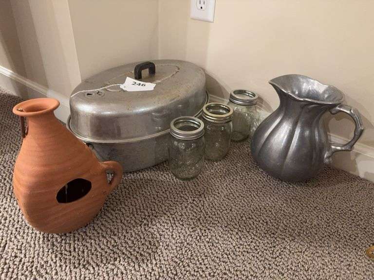 Roaster, silver metal pitcher, canning jars, pottery piece image