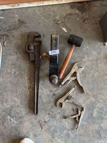 Vise grips, hitch, large pipe wrench, mallet image