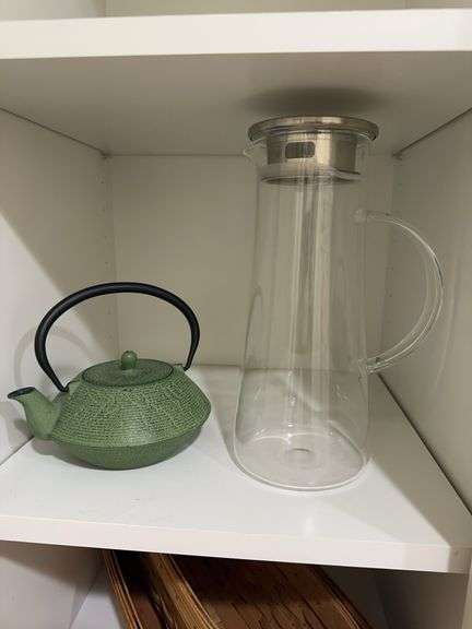Glass pitcher, cast iron tea pot image
