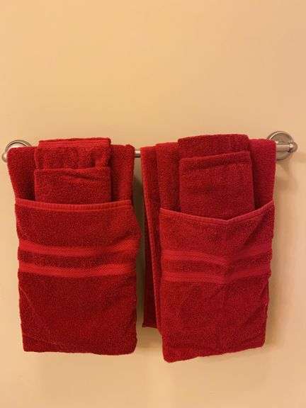 Contents of hall bathroom, towels, suitcases, tablecloths, baskets, contents of vanity image