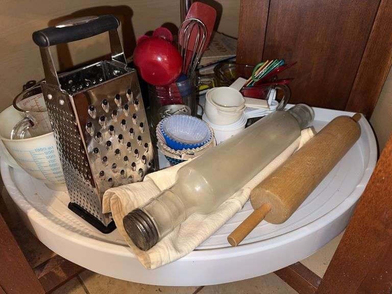 Measuring cups, grater, glass rolling pen, measuring spoons image