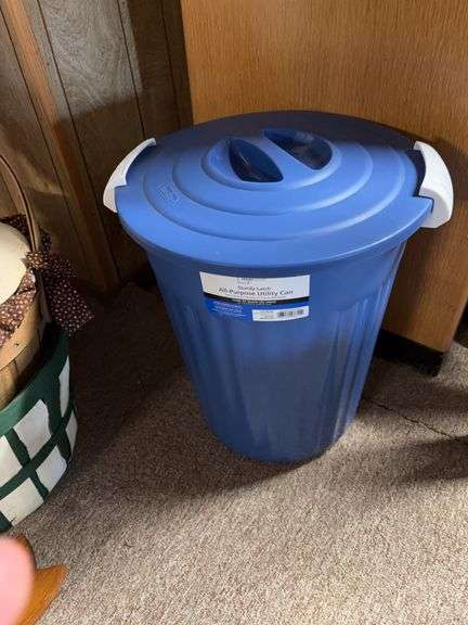 Utility can, large woven basket , small basket ,  floral arrangement and wooden bow wall decor image