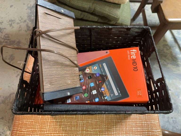 2 Fire HD 10 tablets, vintage strobe light, vintage Bell&Howell camera, Panasonic phones, Amazon pad image