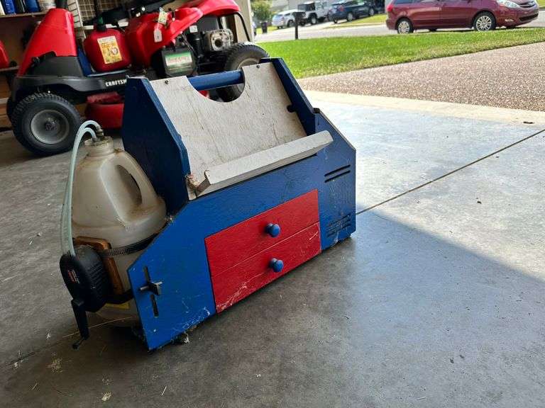 RC airplane tool, fuel, and remote caddy. Airplane craddle image