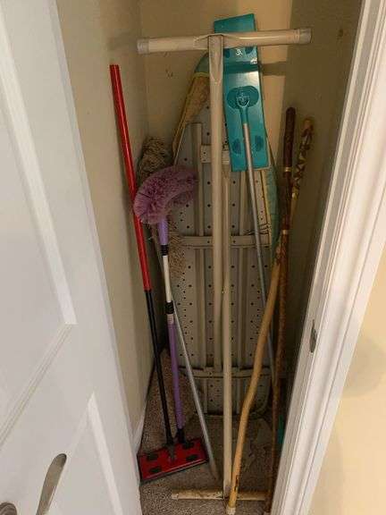 Ironing board, iron, walking sticks, wood candleholder, dusters image