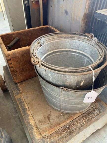 4 galvanized buckets, wood box, sad irons, miscellaneous items image