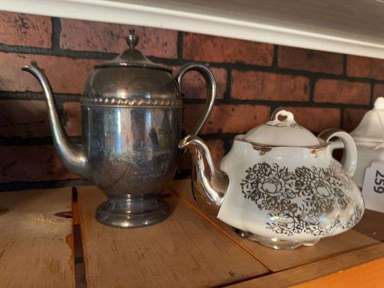 Silver plate teapot, white and silver tea pot image