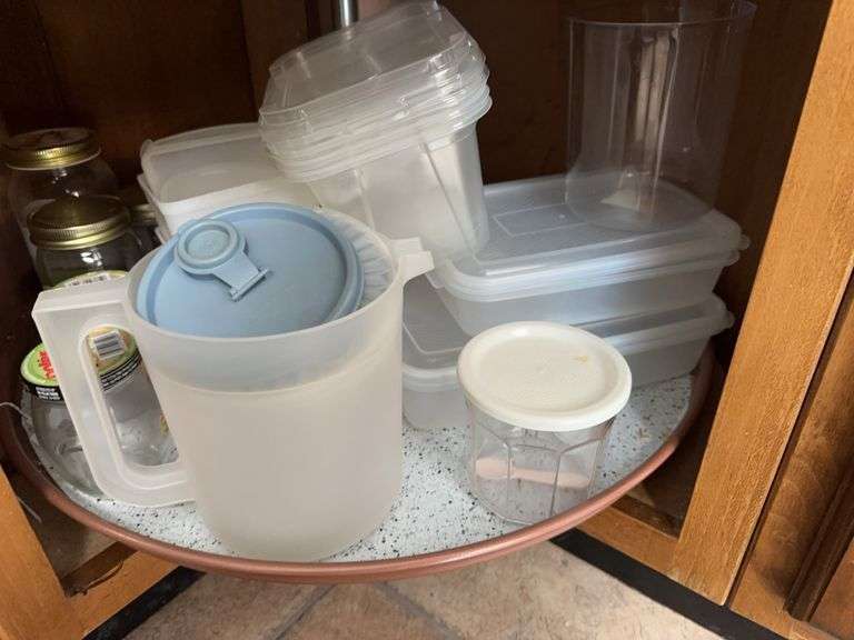 Lot of plastic storage containers, jars image